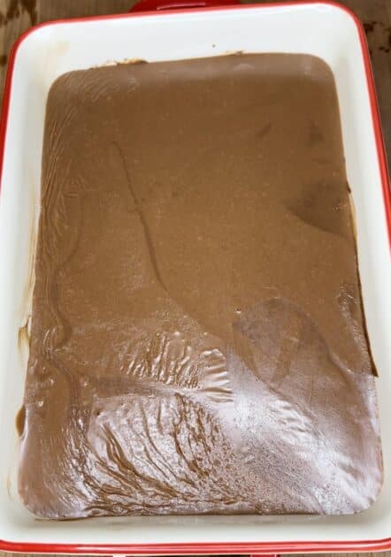 Cooled chocolate frosting on brownies